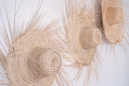 LOVING SURF SALTY BOUTIQUE HOTEL ESSAOUIRA MOROCCO-5371 Decor straw hats on wall in Bright and sunny Triple private room in Salty hotel beside the beach in Essaouira