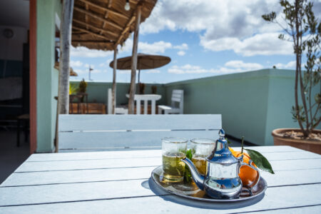 LOVING SURF SALTY BOUTIQUE HOTEL ESSAOUIRA MOROCCO-6349 Moroccan tea served on patio tables in Bright and sunny rooftop terrace in Salty hotel beside the beach
