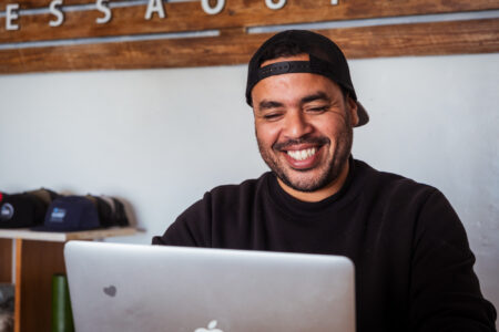 Loving surf Surf shop in Essaouira Morocco with owner younes Adarzane working and laughing