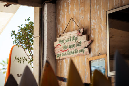 can't stop the wave but you can learn to surf artwork in loving surf shop in essaouira