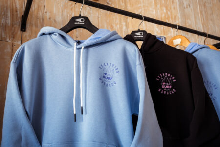 Loving surf hoodies hanging in Surf shop