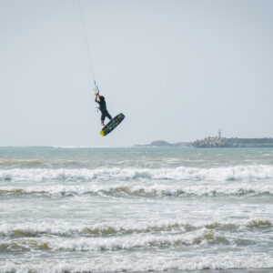 Kitesurfer in Essaouira Morocco jumping in the waves on F-one kiteboarding