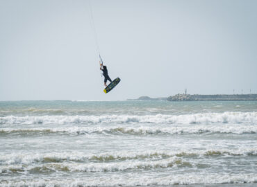 Kitesurfer in Essaouira Morocco jumping in the waves on F-one kiteboarding