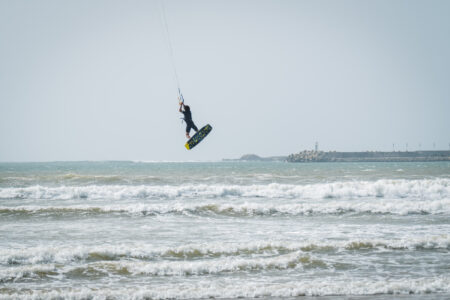 Kitesurfer in Essaouira Morocco jumping in the waves on F-one kiteboarding