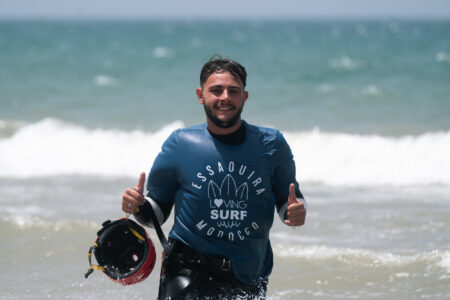 Loving Surf Kite Rental Customer smiling and coming into the beach after kitesurfing in Essaouira Morocco.